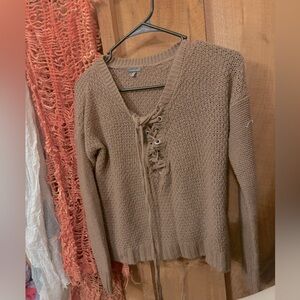 Warm acrylic sweater, muddy maroon. Long strings tie in front